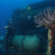 An aquanaut poses by the exterior of Aquarius before Hurricane Irma hit. Image Credit: Kip Evans